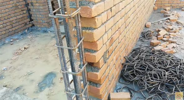 How connection is provided among column and brick wall